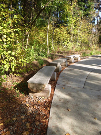 Natural benches along paved entrance route